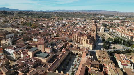 Guadix-city,-plaza-and-cathedral-in-Granada,-Andalusia,-Spain---Aerial-4k-Dolly-Forward