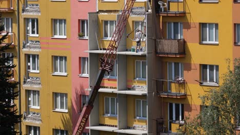 Two-workers-of-Straub-company-building-a-new-balconies-in-Ostrava,-Czech-Republic