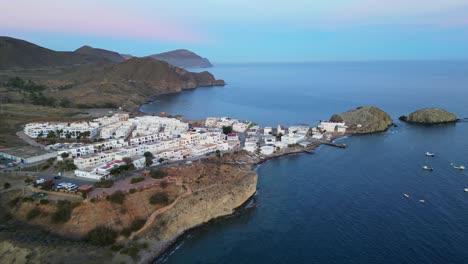 Cabo-de-Gata-Coast-during-twilight-in-Isleta-del-Moro,-Almeria,-Andalusia,-Spain---Aerial-4k