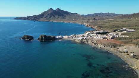 Cabo-de-Gata-Coast-and-Village-Isleta-del-Moro-in-Almeria,-Andalusia,-Spain---Aerial-4k-Circling