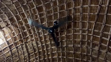 Ceiling-fan-in-a-tropical-thatched-hut