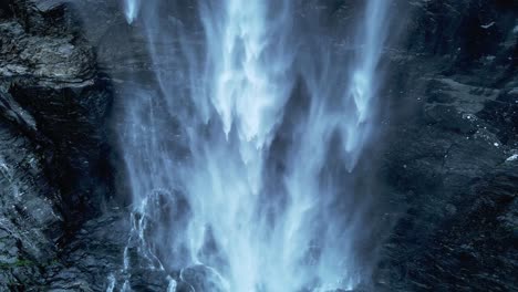 Aerial-top-down-shot-of-falling-water-downhill-mountain-in-wilderness-of-Norway--Beautiful-peaceful-waterfall-in-Norwegian-mountains