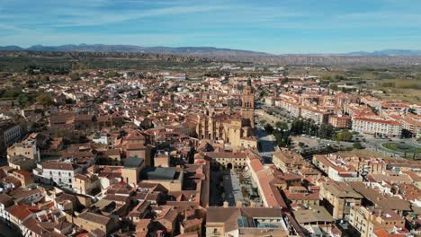 Guadix-city-and-cathedral-in-Granada,-Andalusia,-Spain---Aerial-4k-Dolly-Forward