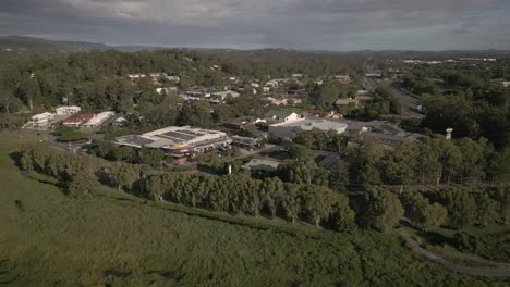 Aerial-over-shops-at-Mudgeeraba,-a-suburb-on-the-Gold-Coast,-Australia