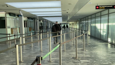 Travelers-walking-slowly-to-the-border-control-counter-at-Oslo-Airport