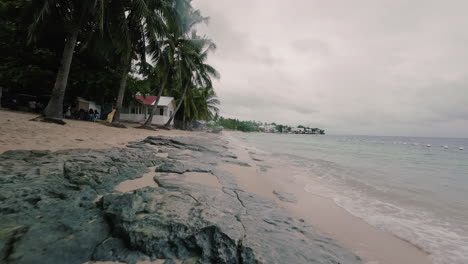 Drone-along-shoreline-in-Alegria-Cebu