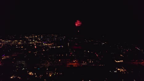 Aerial-view-flying-sideways-of-fireworks-at-Mindarie-marina-in-Perth-Western-Australia