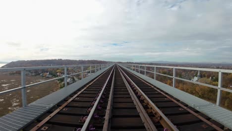 FPV-drone-following-railroad-bridge-and-going-under-it-2