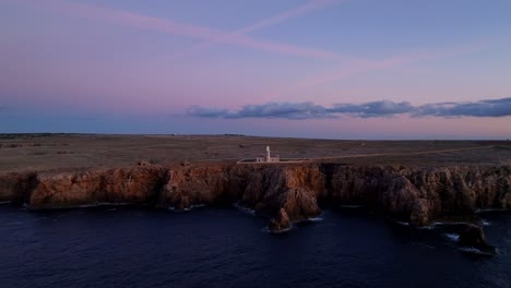 Aerial-flight-towards-Punta-Nati-Lighthouse