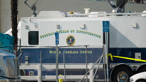 A-Close-Up-of-the-FBI-Mobile-Command-Center-Parked-Outside-the-Star-Ballroom-Dance-Studio-the-Morning-After-the-Shooting