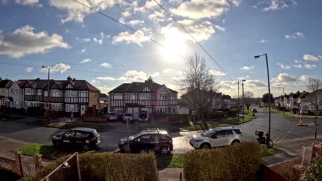 Time-Lapse-View-Of-Sun-Moving-Across-Sky-With-Rolling-Clouds-Going-By-Over-Residential-Street-In-London