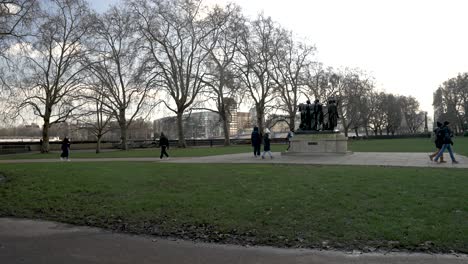 Tourists-Walking-Past-The-Burghers-of-Calais-Sculpture-Located-In-Victoria-Tower-Gardens-South-In-Westminster-On-Winter-Day-In-January-2023