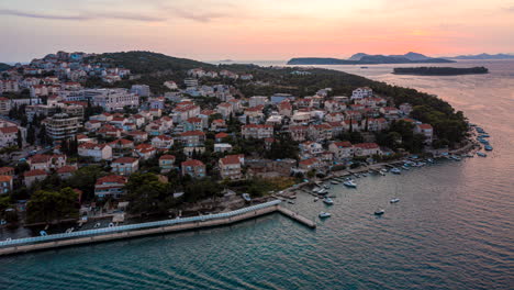 Rising-aerial-hyperlapse-of-boats-sailing-through-the-Adriatic-Sea-off-the-coast-of-Dubrovnik,-Croatia