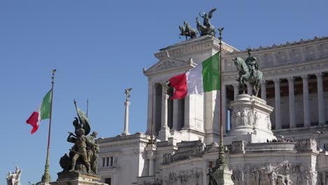 Rome's-public-landmark,-Alter-of-the-Fatherland,-on-a-bright-summer-day-with-flags-waving-in-the-wind