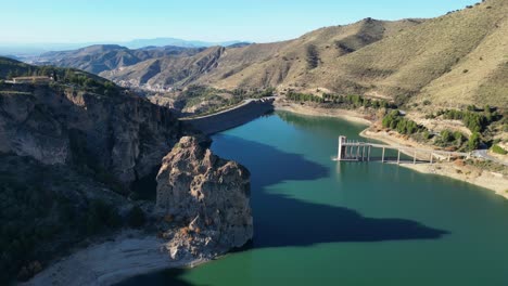 Canales-Water-Reservoir-in-Sierra-Nevada,-Andalusia,-Spain---Aerial-4k-Circling