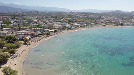 Panoramic-View-Of-A-Crystal-Clear-Beach-In-Tropical-Resort-Of-Chania-Town,-Crete-Island,-Greece