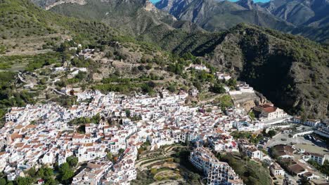 Frigiliana-white-village-in-mountains-of-Malaga,-Andalusia,-Spain---Aerial-4k-Tilting-Up