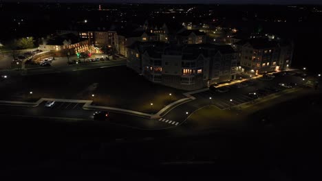 Aerial-view-of-car-driving-in-retirement-home-community-at-night