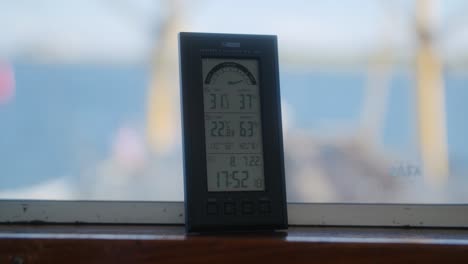 Information-chart-that-tells-the-time-and-temperature-in-digital-and-other-data,-located-on-a-boat