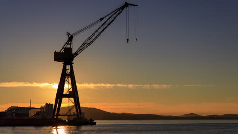 Sunset-behind-large-vintage-industrial-crane