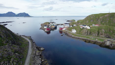 Aerial-descending-shot-of-a-Norwegian-historical-fishing-village,-calm-nice-summer-day,-Nyksund,-Northern-Norway