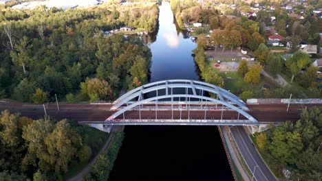 Buttery-soft-aerial-view-flight-speed-ramp-Hyperlapse-motionlapse-timelapse
Railway-bridge-over-river,-port-in-brandenburg-Germany-at-summer-golden-hour-2022