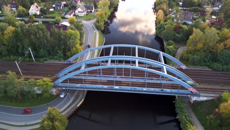 Dramatic-aerial-view-flight-panorama-orbit-drone-of-a
Railway-bridge-over-river-havel-channel-in-brandenburg-Germany-at-summer-golden-hour-2022