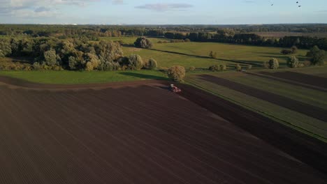 Majestic-aerial-view-flight-drone-shot-footage-from-above-of-a
tractor-on-autumn-field-in-brandenburg-havelland-Germany-at-summer-2022