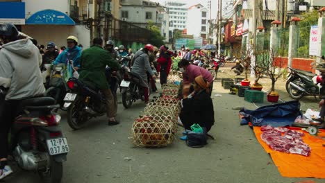 Static-shot-of-people-trying-to-sell-live-chickens-in-the-street-of-Lang-Son