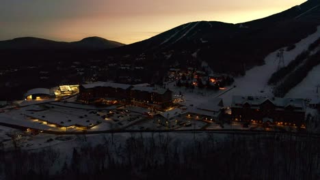 Golden-sunset-over-a-ski-mountain-and-resort--Drone-video