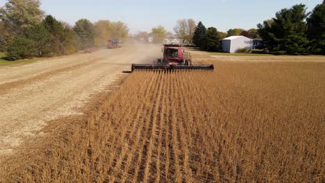 Combine-harvesting-soybeans-with-rotating-header-in-Monroe-County-Michigan,-USA