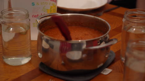 bowl-of-red-pasta-sauce-at-dinner-table