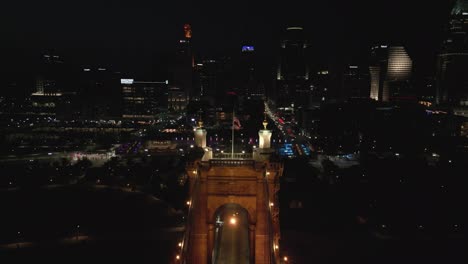 Aerial-Backup-of-Suspension-Bridge-Tower-and-Downtown-Cincinnati,-Ohio