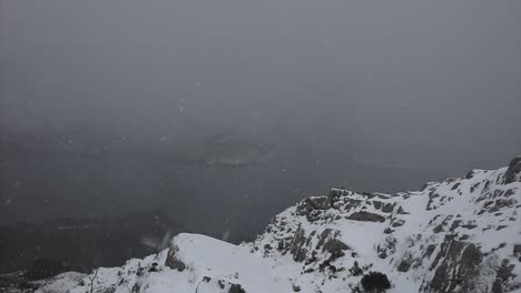 snow-falling-on-mountain,-slo-mo,-Torridon,-Highlands,-Scotland
