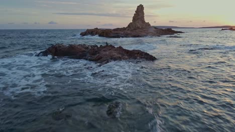 Fpv-view-of-reddish-Cala-Pregonda-mediterranean-sea-Spain