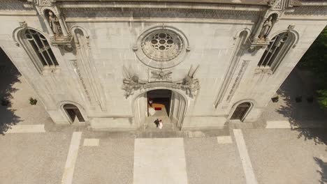 Wedding-Day-bride-entering-church-to-get-married-Aerial-View