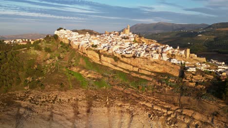 Iznajar-white-mountain-village-in-Andalusia,-Spain---Aerial-4k-Pedestal-Up