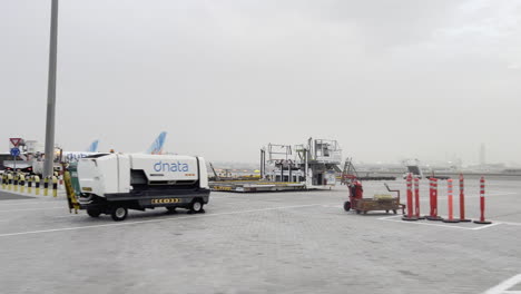 Dubai-airport-logistics,-garbage-cars-and-cleaning-for-airplanes-and-runaways