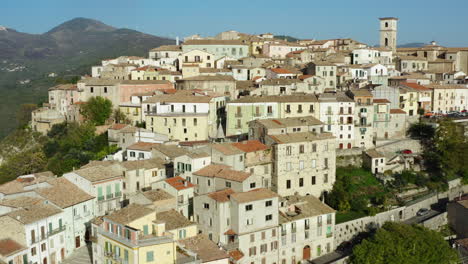 Aerial-reveal-shot-of-historic-hilltop-old-town-Trivento-in-Molise-region-in-Italy