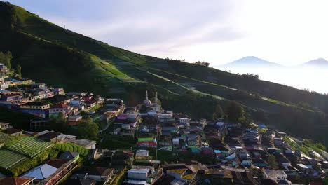 Aerial-view-of-beautiful-village-and-plantation-on-the-slope-of-mountain