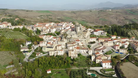 Aerial-orbiting-left-shot-of-medieval-Pietracupa-old-town-with-an-old-church-built-on-rock-in-Molise-region-in-Italy