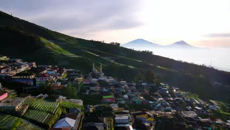 Aerial-view-of-beautiful-Butuh-Village-with-Mosque-on-Mount-Sumbing,-Indonesia-during-Sunset