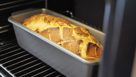 Handheld,-close-up-view-of-a-freshly-baked-loaf-of-bread-in-the-oven