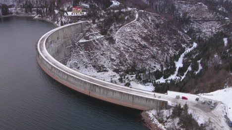 Aerial-view-of-the-Lake-and-the-big-Dam-from-Valea-Draganului-in-Winter-time-around-Transylvania,-Romania