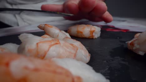 Chef-takes-a-fresh-shrimp-to-prepare-cebiche