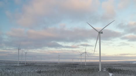 Wind-farm-landscape-during-the-winter-in-europe,-aerial-scenic-view-of-an-eolic-energy-generation-plant