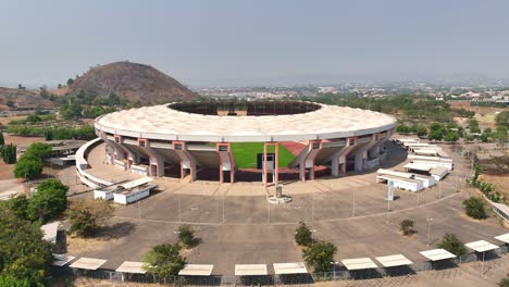 Descending-wide-aerial-shot-of-a-football-stadium-in-Africa