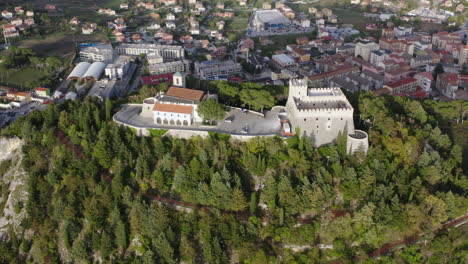 Tight-aerial-orbiting-left-shot-of-Monforte-Castle-in-Campobasso-with-city-in-the-background