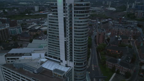Pull-Back-Establishing-Drone-Shot-of-Bridgewater-Place-Skyscraper-in-Leeds-City-Centre-in-Low-Light-at-Blue-Hour-West-Yorkshire-UK
