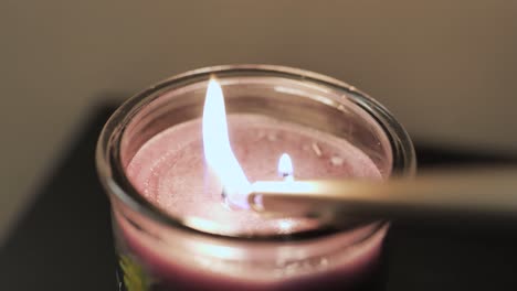 Lighting-a-candle-with-two-wicks-two-fires-one-candle